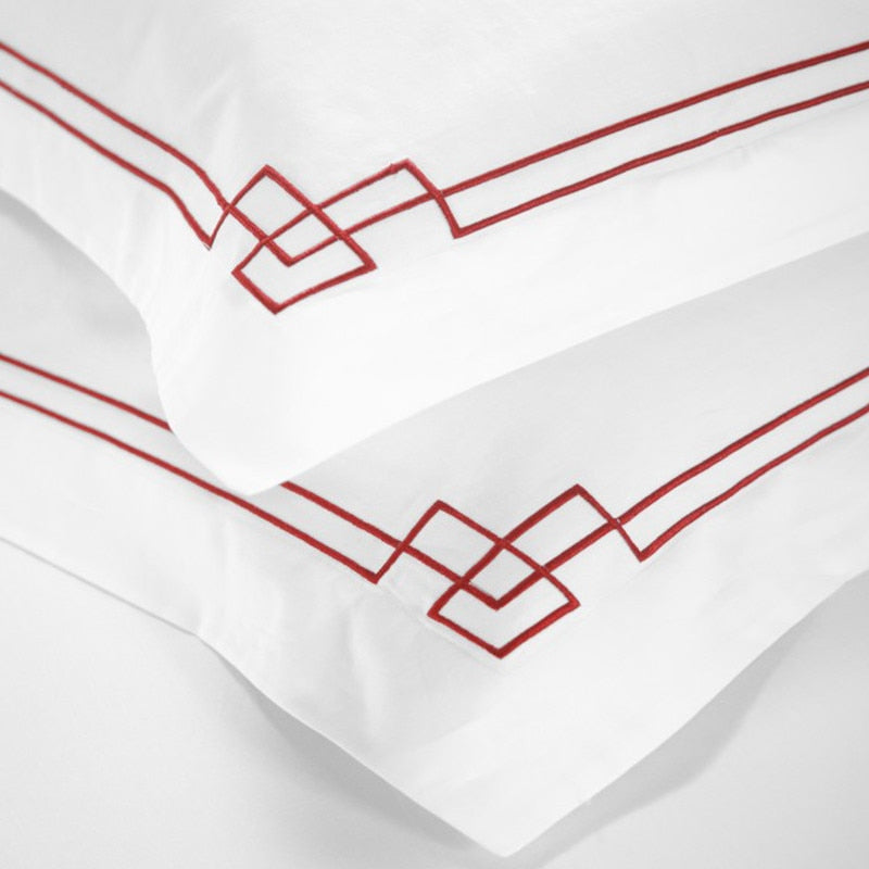 Taormina Bedding Sets: Luxury White Organic Cotton Duvet Cover Set with Vibrant Red Embroidery